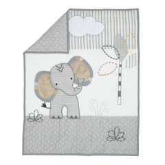 Lambs & Ivy mini crib bedding set contents shown with quilt and sheets.