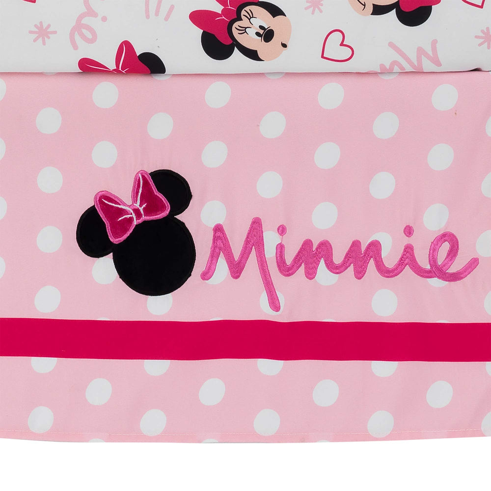 Lambs & Ivy Minnie Love hot pink bow provides playful color pop during bedtime.