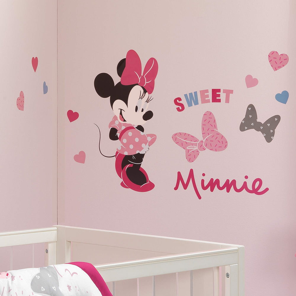 Lambs and Ivy Minnie polka-dot dress detail adds bright, whimsical nursery decor