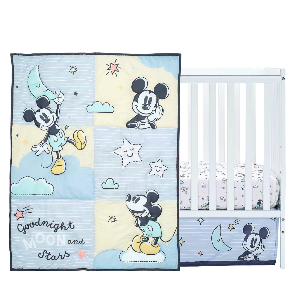 Lambs & Ivy Moonlight Mickey sheet shows soft texture for nursery comfort.