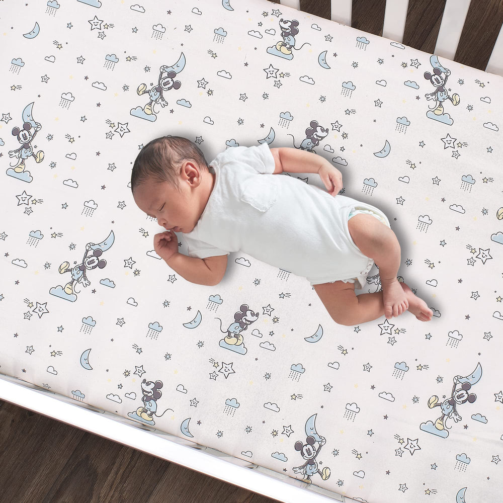 Lambs & Ivy Moonlight stars and moon motif creates a soothing bedtime scene.