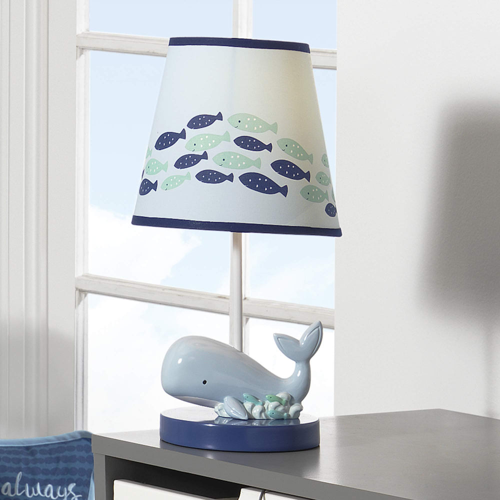 Lambs & Ivy Oceania coordinates with Oceania bedding for a cohesive theme.