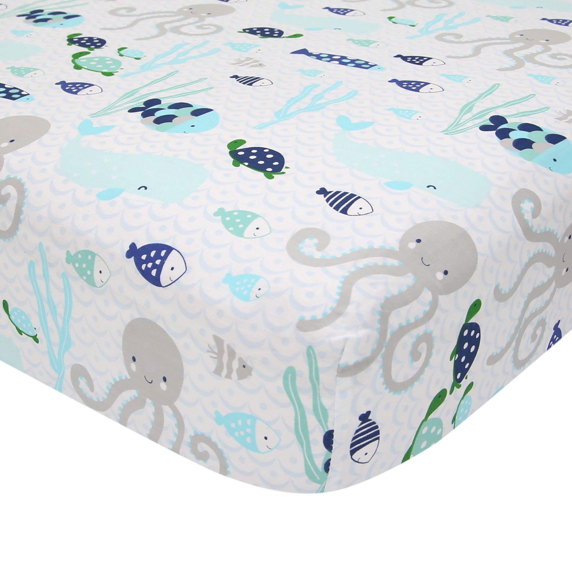 Lambs & Ivy Oceania second fitted sheet close-up highlighting elastic edge for crib safety