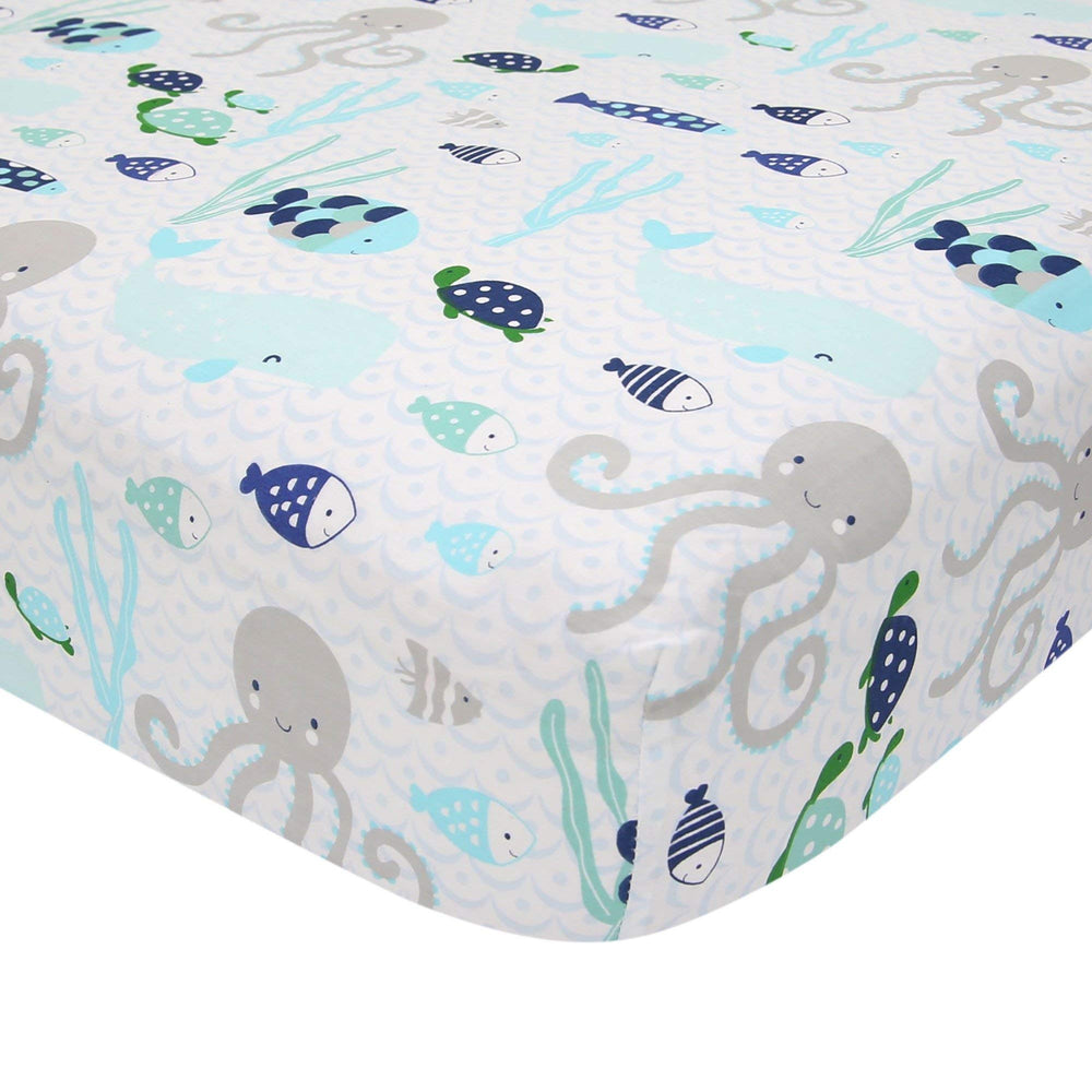 Lambs & Ivy Oceania second fitted sheet close-up highlighting elastic edge for crib safety