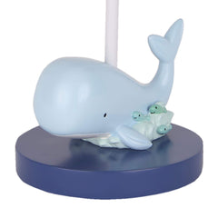 Lambs & Ivy Oceania lamp shade with fish adds calming nautical ambiance.