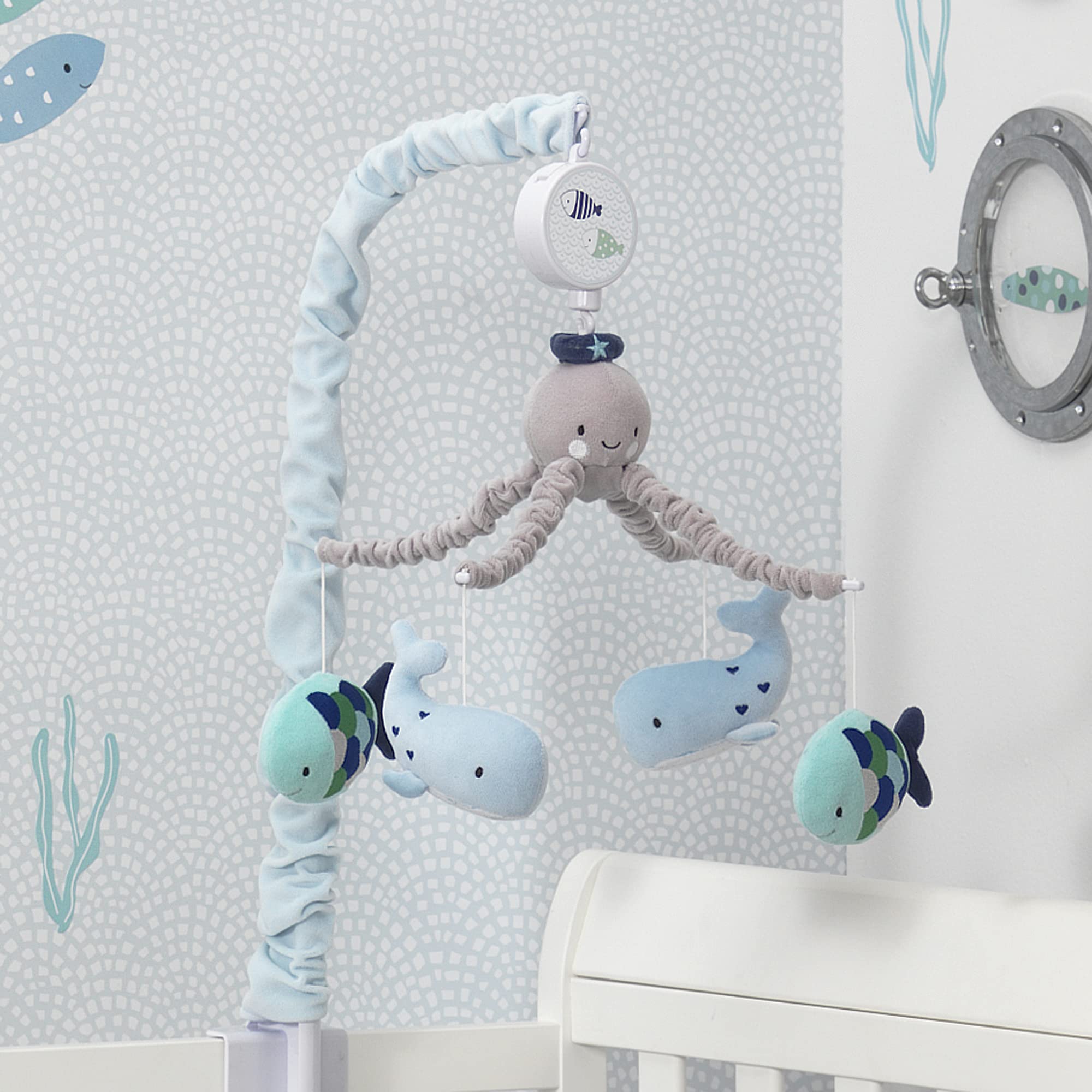 Lambs & Ivy Oceania crib mobile setup showcases undersea decor.