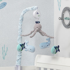 Lambs & Ivy Oceania crib mobile setup showcases undersea decor.