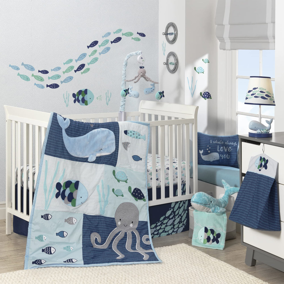 Lambs & Ivy Oceania quilt with blue ocean design to inspire a calming nautical nursery