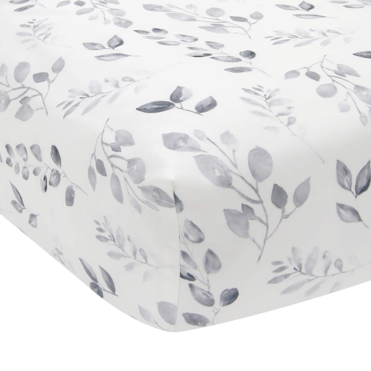 Lambs & Ivy Painted Forest crib sheet features gray watercolor leaves for a soft, coordinated nursery.
