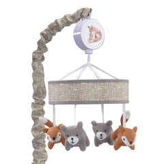 Lambs & Ivy Painted Forest mobile with knitted fox and bear spinning softly to soothe baby.