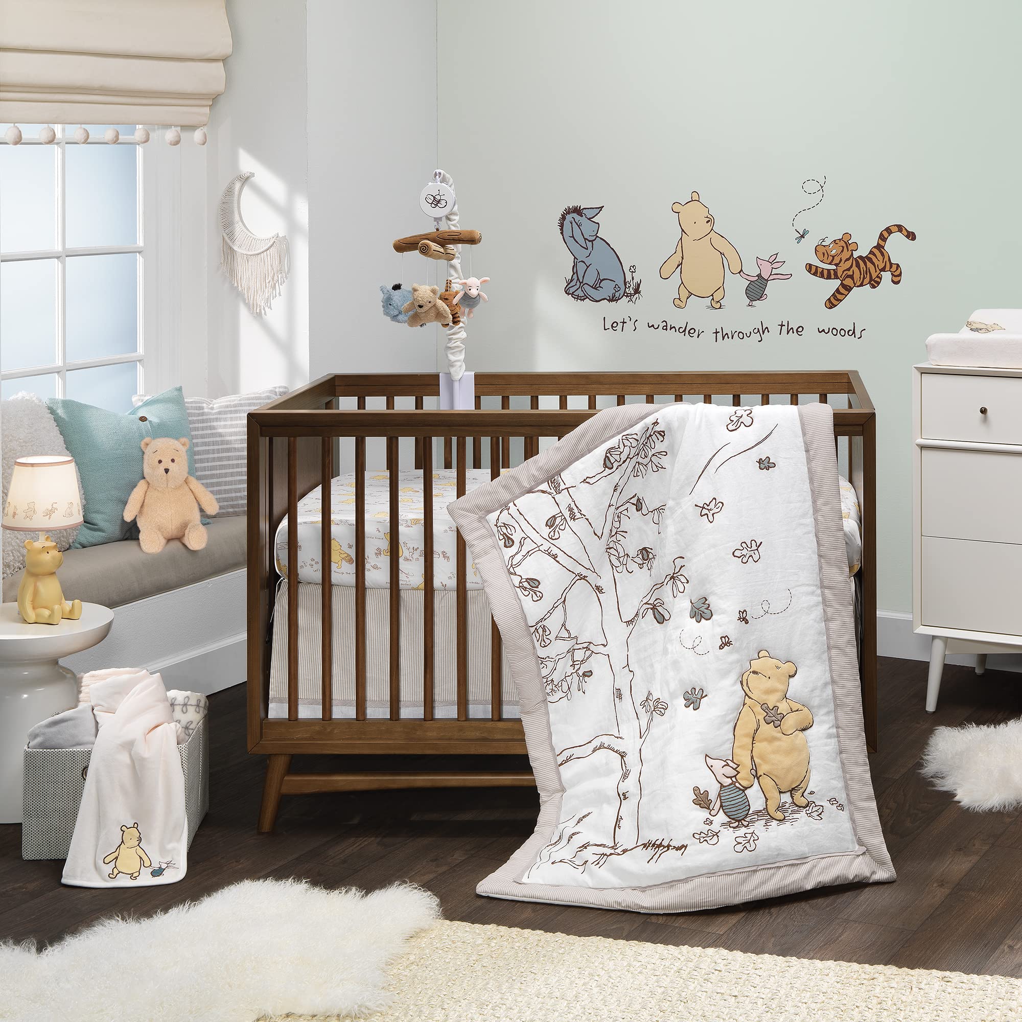 Lambs & Ivy Disney Pooh mobile helps baby self-soothe with lullabies and soft visuals.