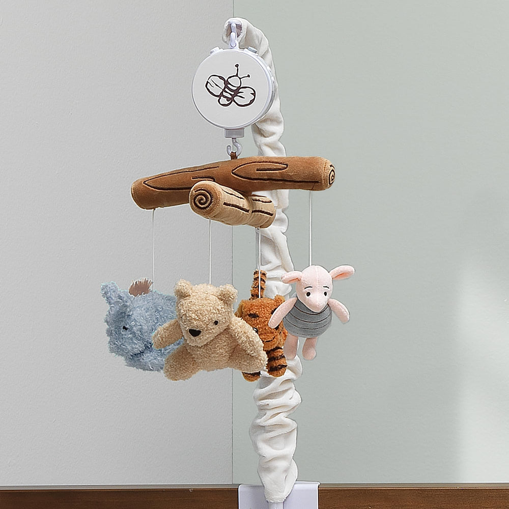 Lambs & Ivy Pooh mobile includes volume control for easy, personalized soothing.