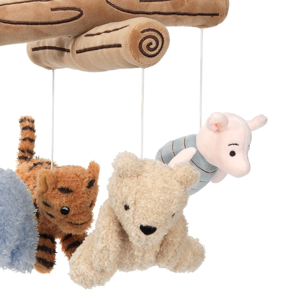 Lambs & Ivy Pooh plush animals rotate to encourage visual tracking and focus.