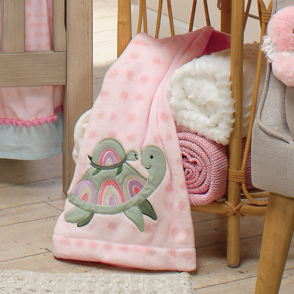 Lambs & Ivy Sea Dreams pink fleece blanket for bedtime cuddles.