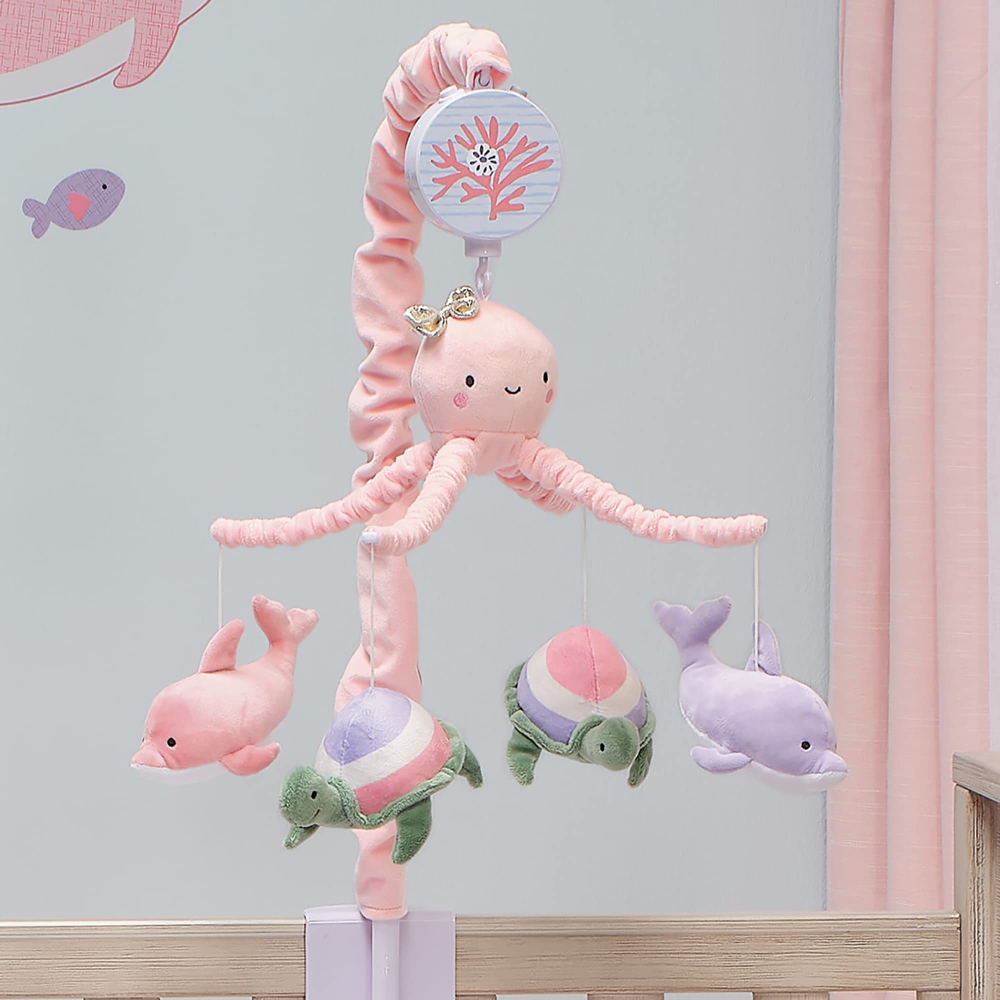 Lambs & Ivy Sea Dreams crib mount shown above crib space