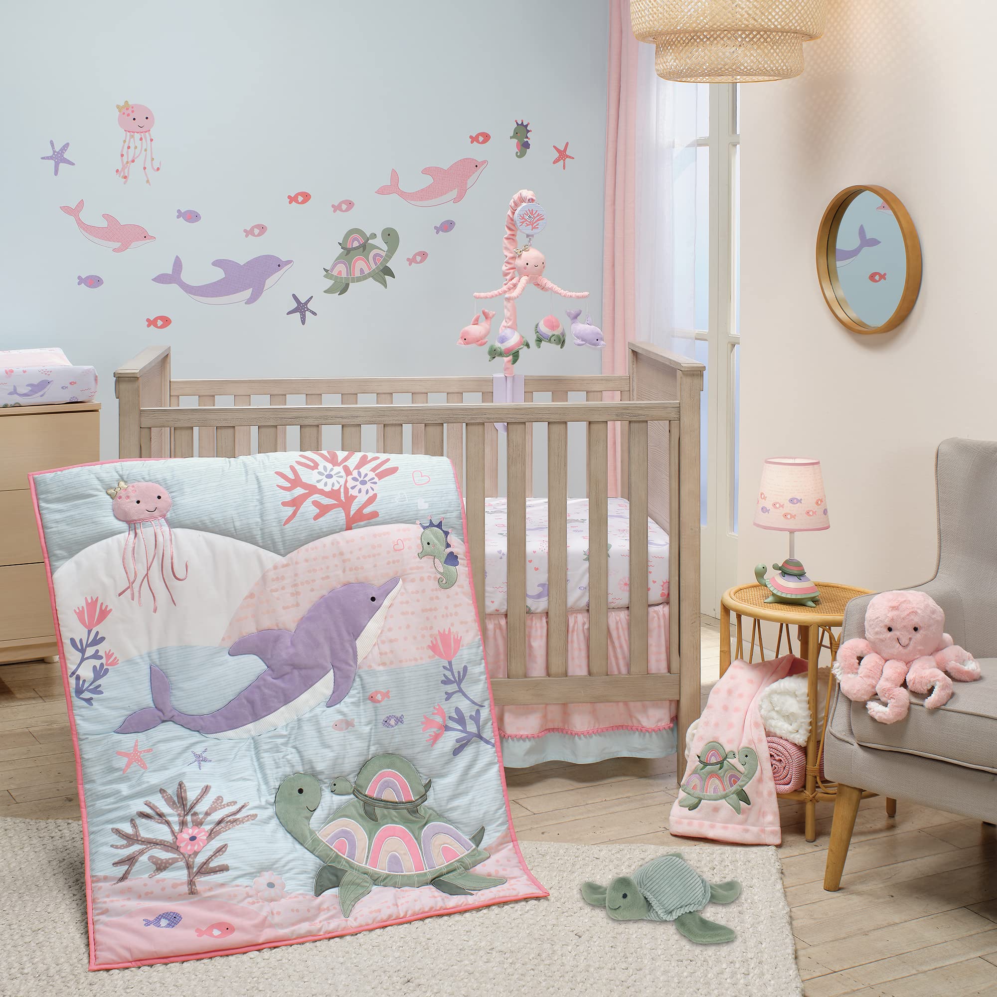 Lambs & Ivy Sea Dreams pink colorway enhances nursery decor.