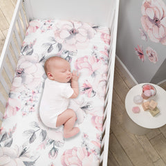 Lambs & Ivy Signature Botanical Baby Watercolor Crib Sheet closeup reveals pink and gray florals in crisp detail.