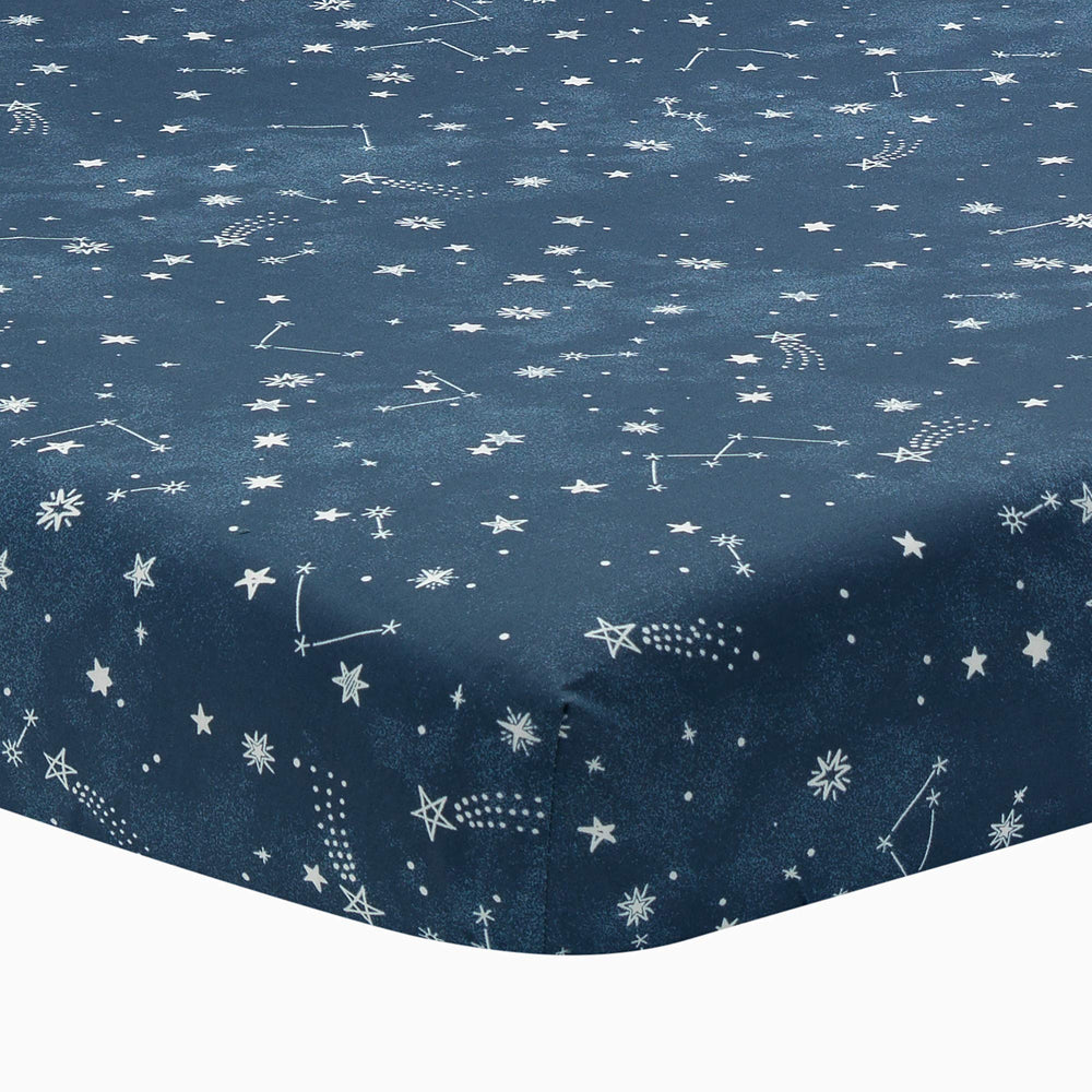 Lambs and Ivy Sky Rocket sheet closeup shows breathable cotton for baby comfort