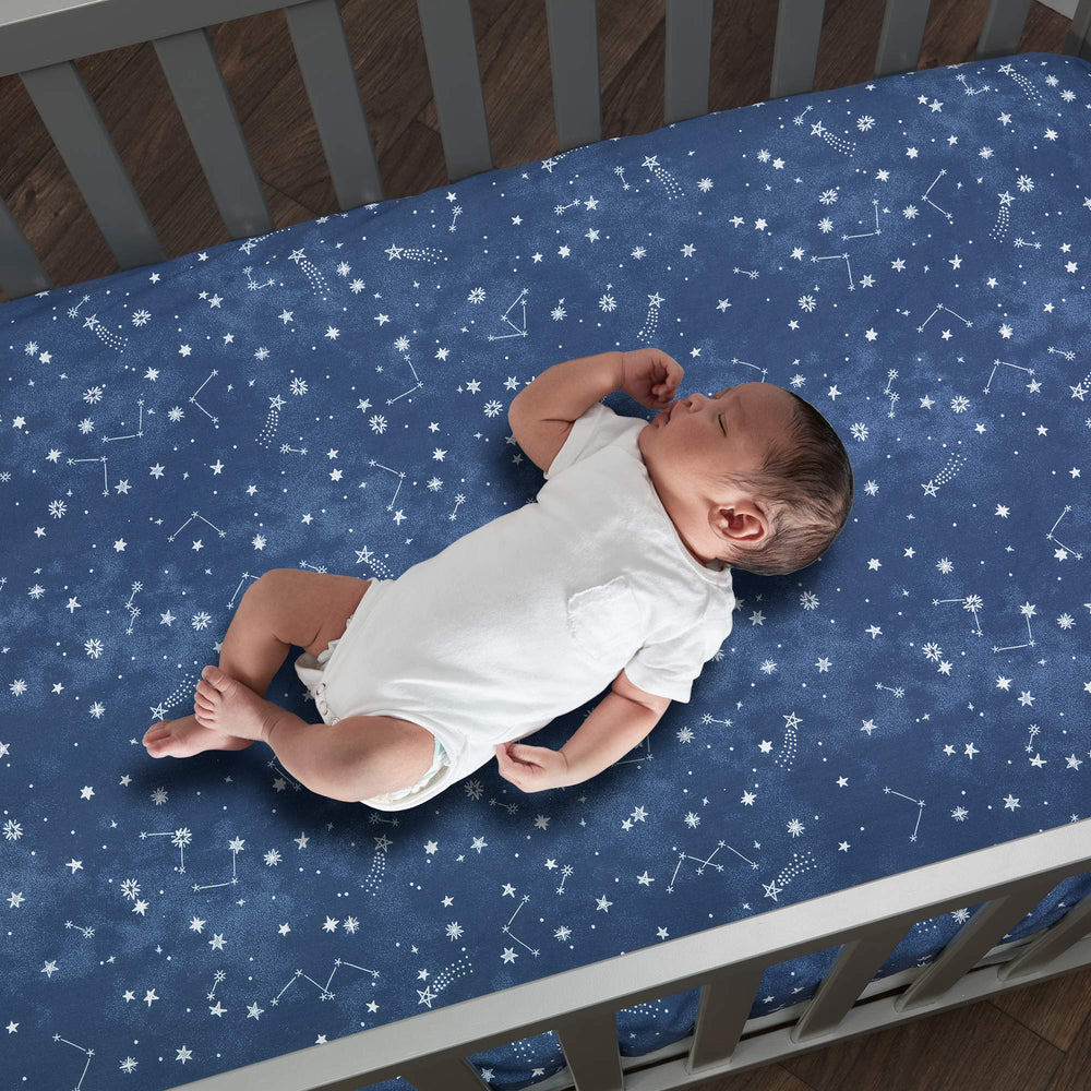 Lambs and Ivy Sky Rocket navy stars on blue ground for versatile nursery styling