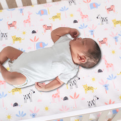 Lambs & Ivy Snuggle Jungle pastel crib sheet on standard crib mattress with secure edge