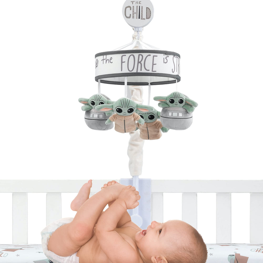 Lambs & Ivy Star Wars mobile plays nursery songs for baby's soothing routine.
