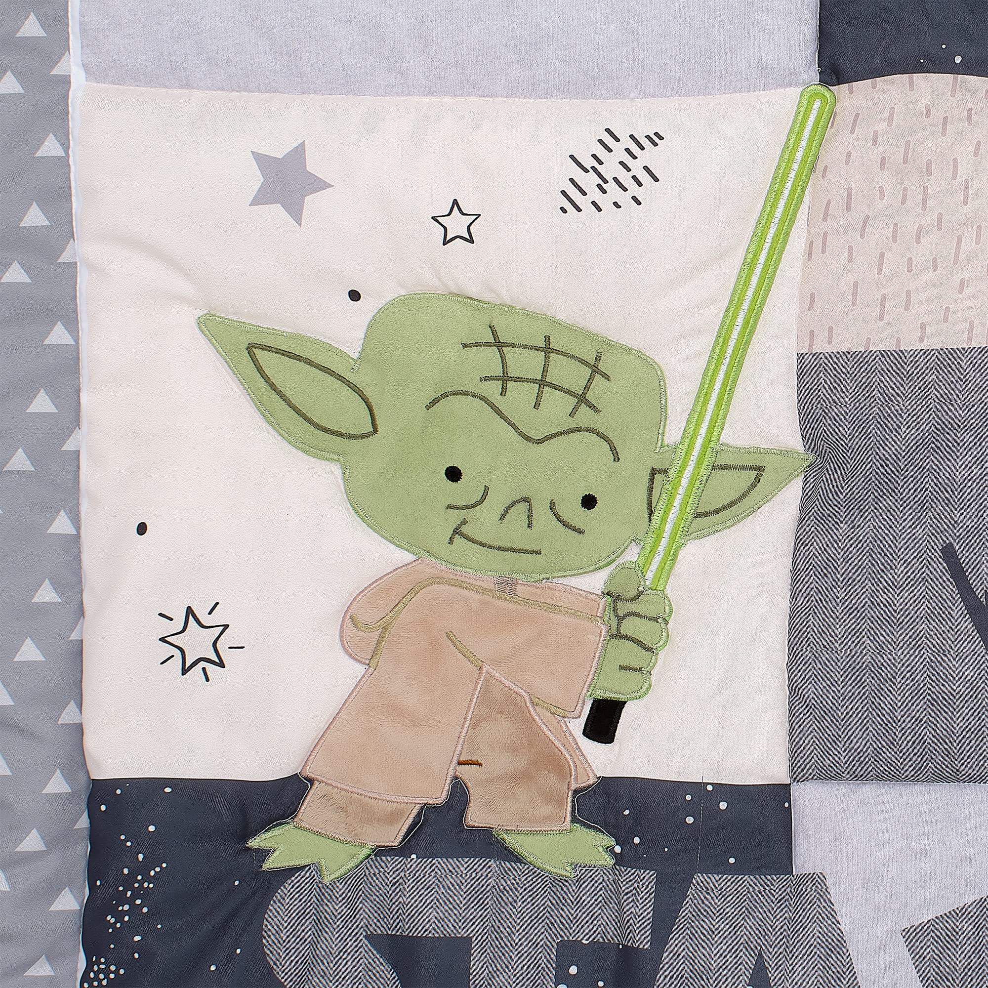Lambs & Ivy Star Wars quilt texture closeup with embroidery detail