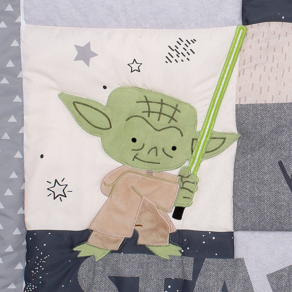 Lambs & Ivy Star Wars quilt texture closeup with embroidery detail