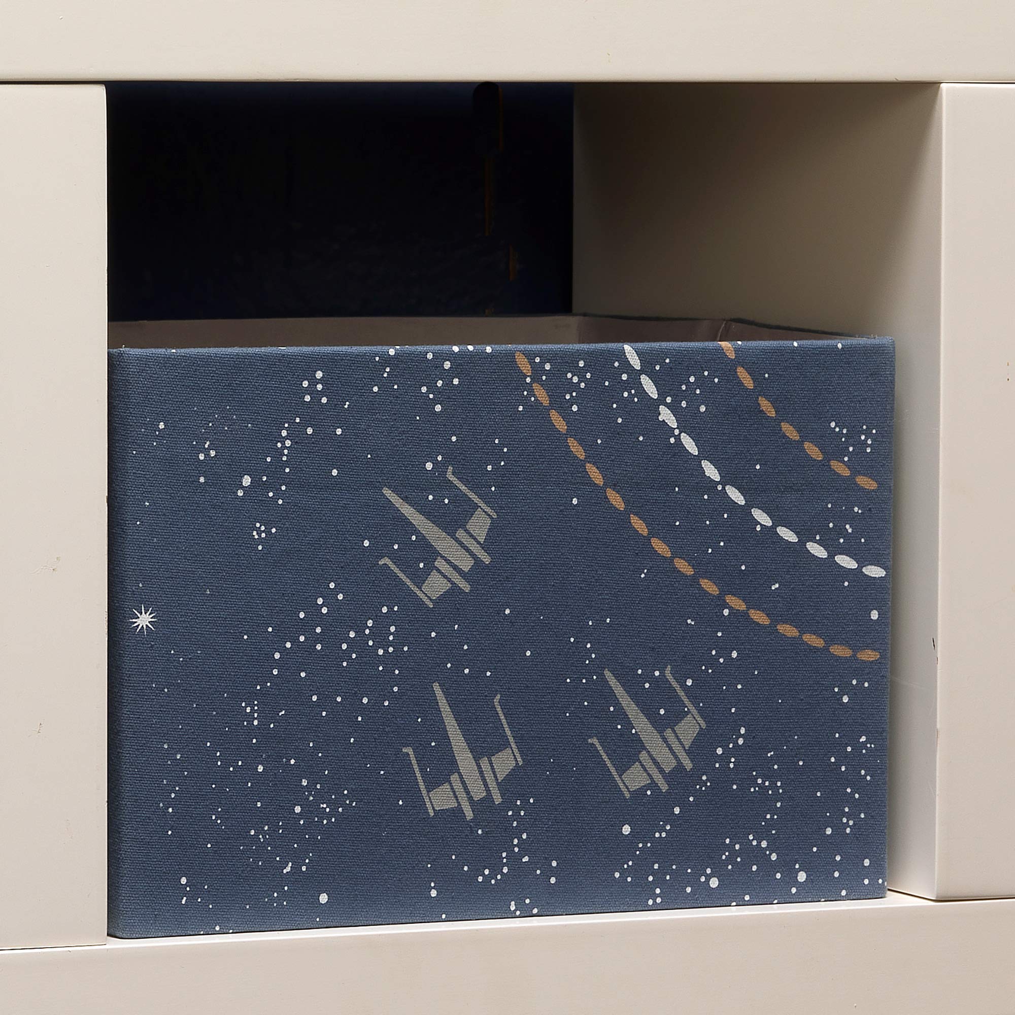 Lambs & Ivy Star Wars Galaxy bin canvas texture highlighting durability and style.