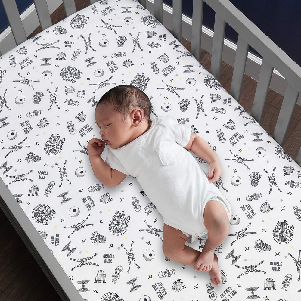 Lambs & Ivy Star Wars Darth Vader print showcases iconic design for themed nurseries.