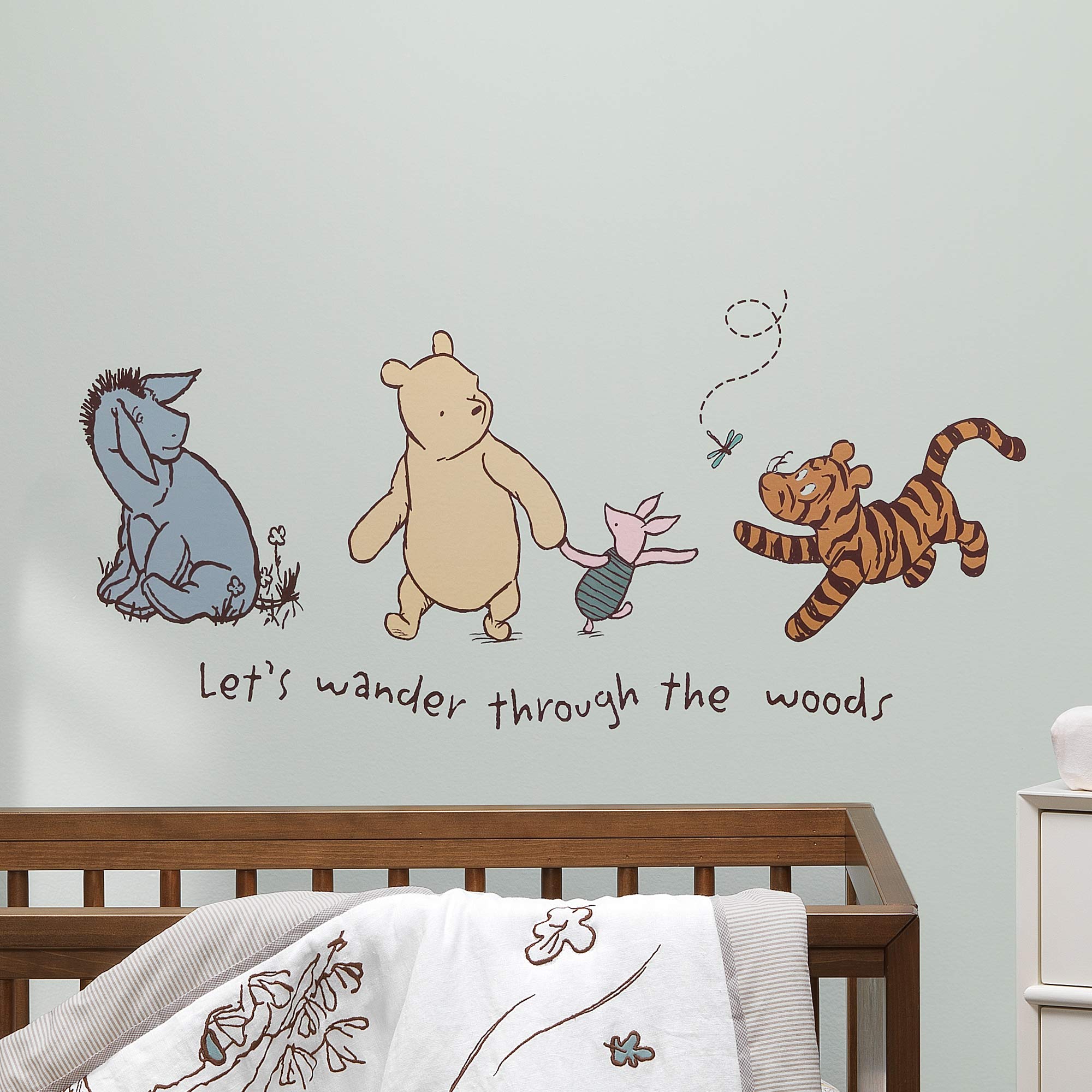 Lambs & Ivy Storytime Pooh wall decal close-up of dragonfly detail in beige.