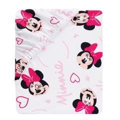 Lambs & Ivy Minnie Love print showing playful Minnie heads on white fabric.