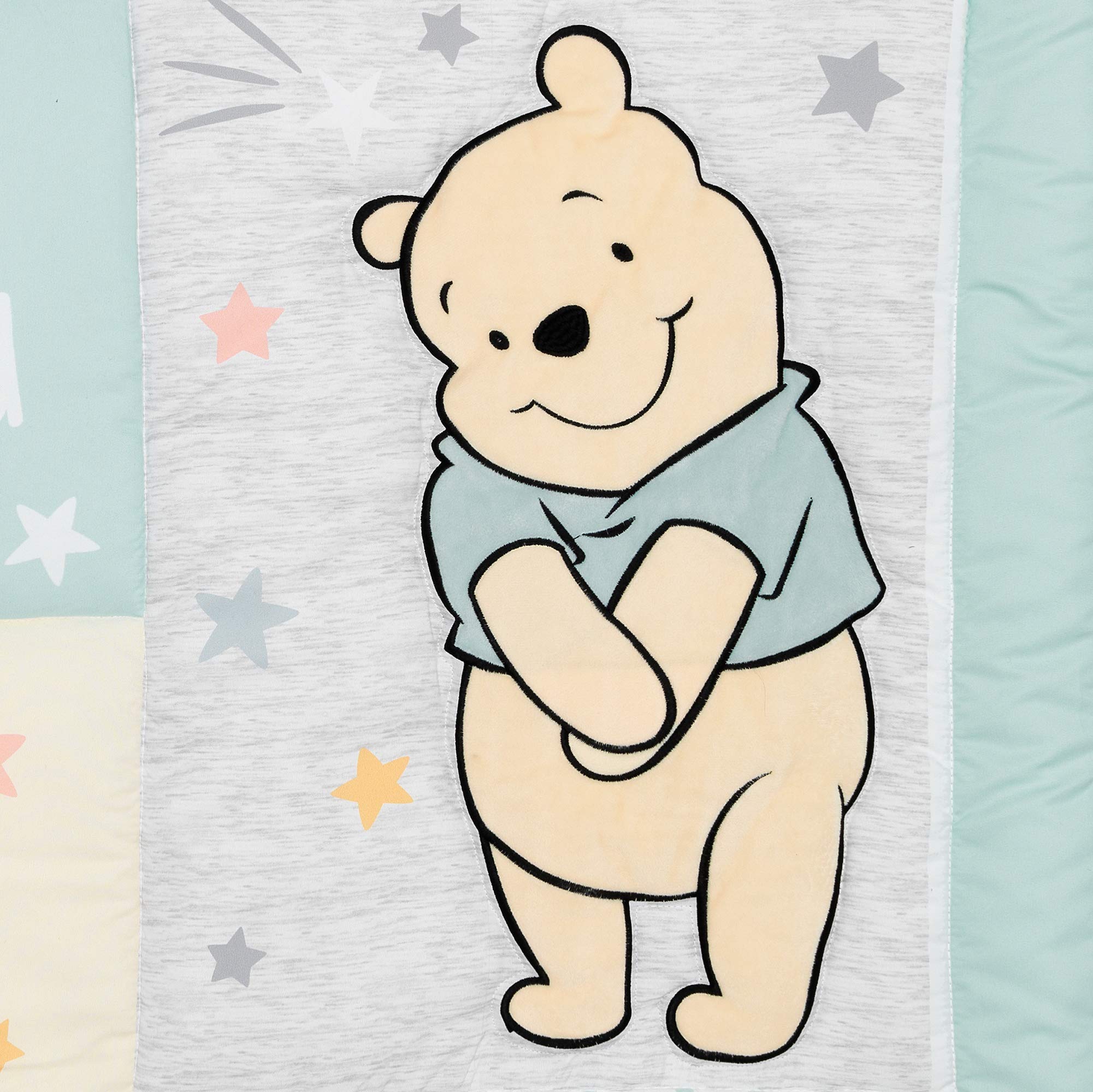 Lambs & Ivy Winnie the Pooh Hugs gender-neutral nursery palette works with many decor styles.