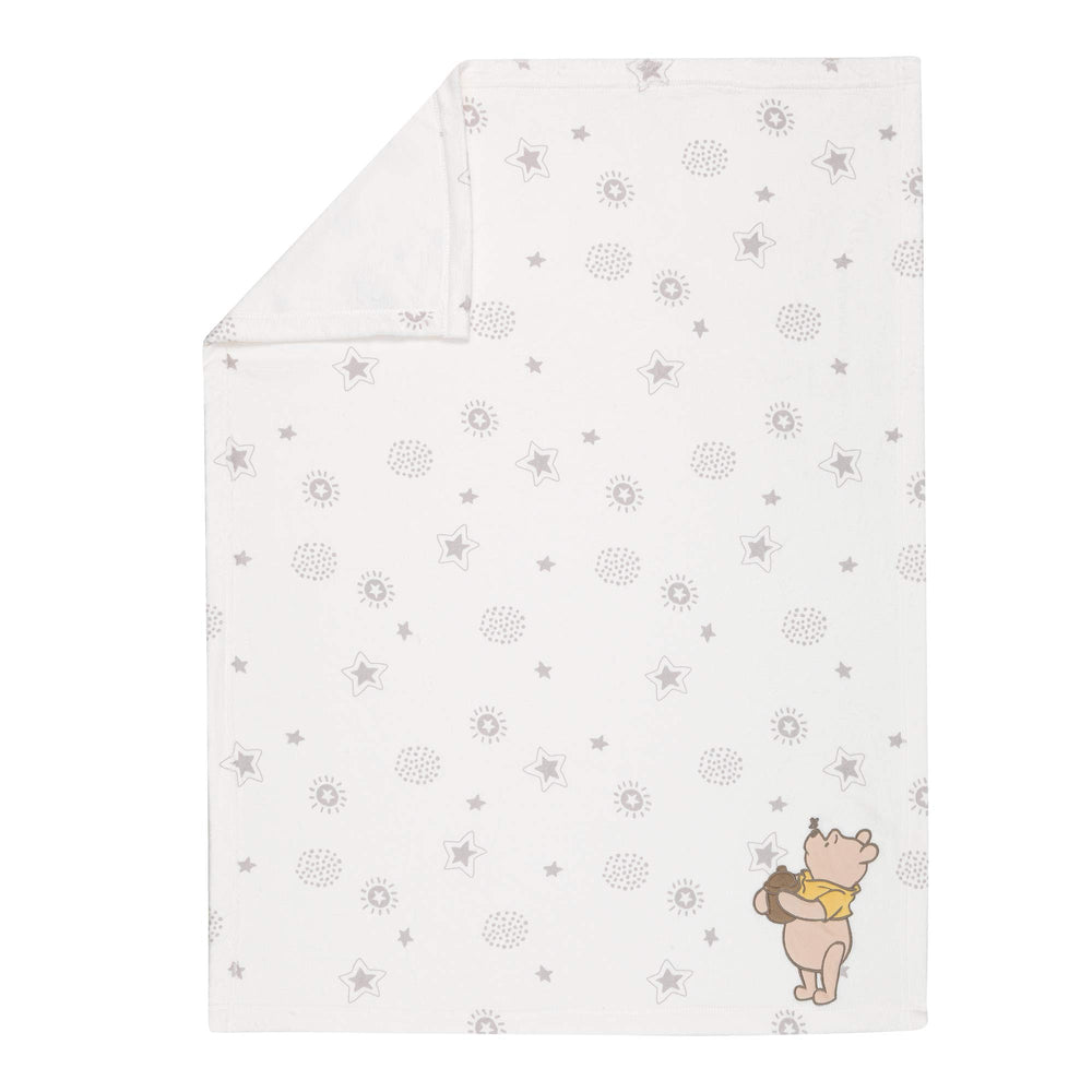 Lambs & Ivy Pooh stardust print invites dreamy naps