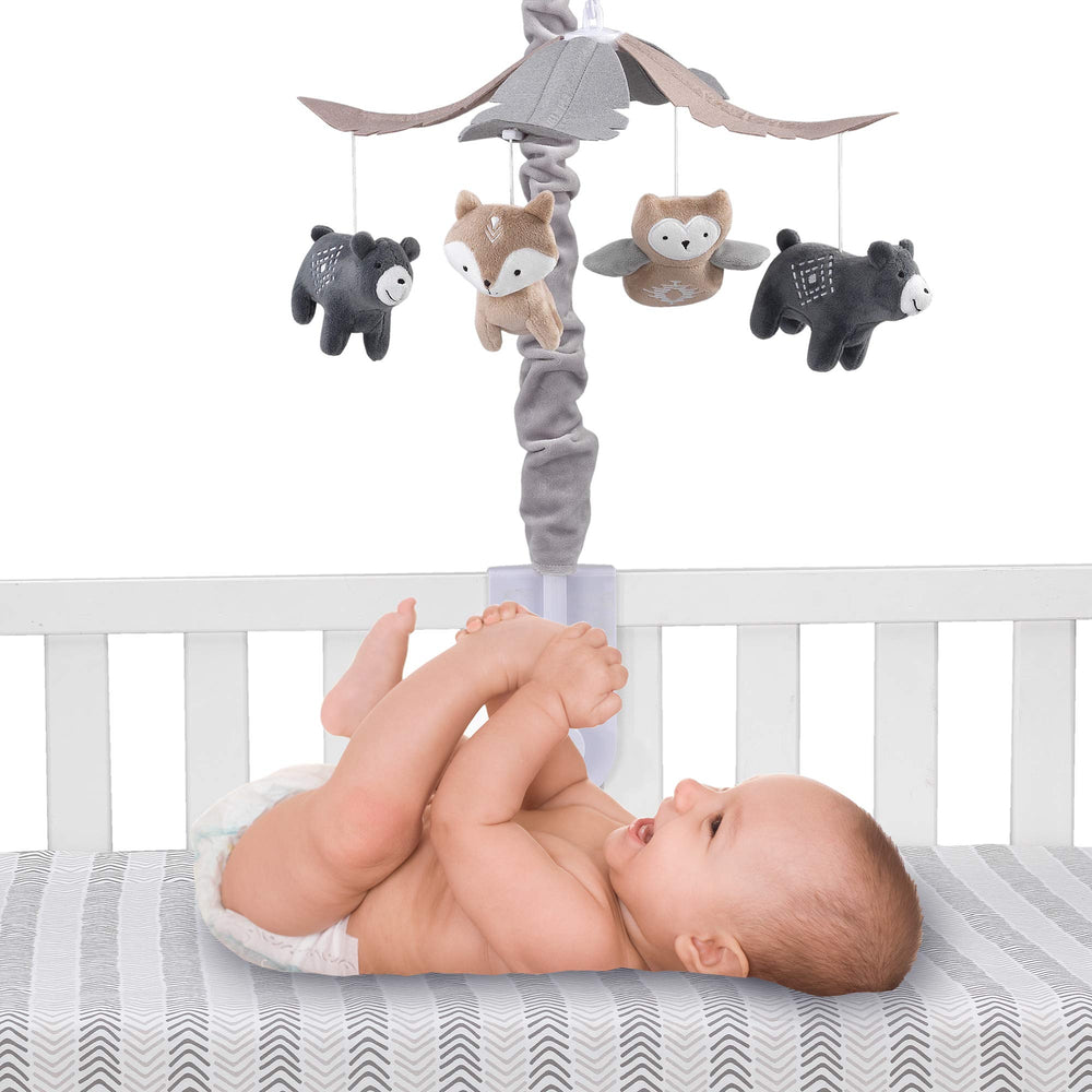 Lambs & Ivy Woodland Forest mobile rotation emphasizes soothing visuals for newborn engagement
