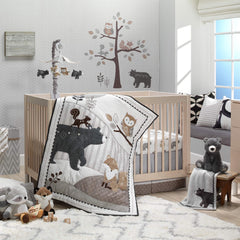 Lambs & Ivy Woodland Forest quilt shows detailed animal appliques for nursery charm