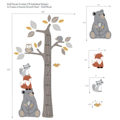 Lambs & Ivy woodland tree decal close-up highlights friendly animals ready to spark storytelling.