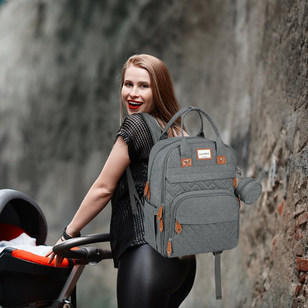 LANDICI diaper bag backpack in-use with mom and dad showcases versatile travel companion