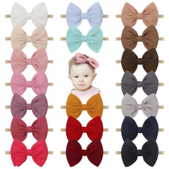 Lanmerry baby bow headband 4.5-inch close-up shows soft nylon for gentle comfort.