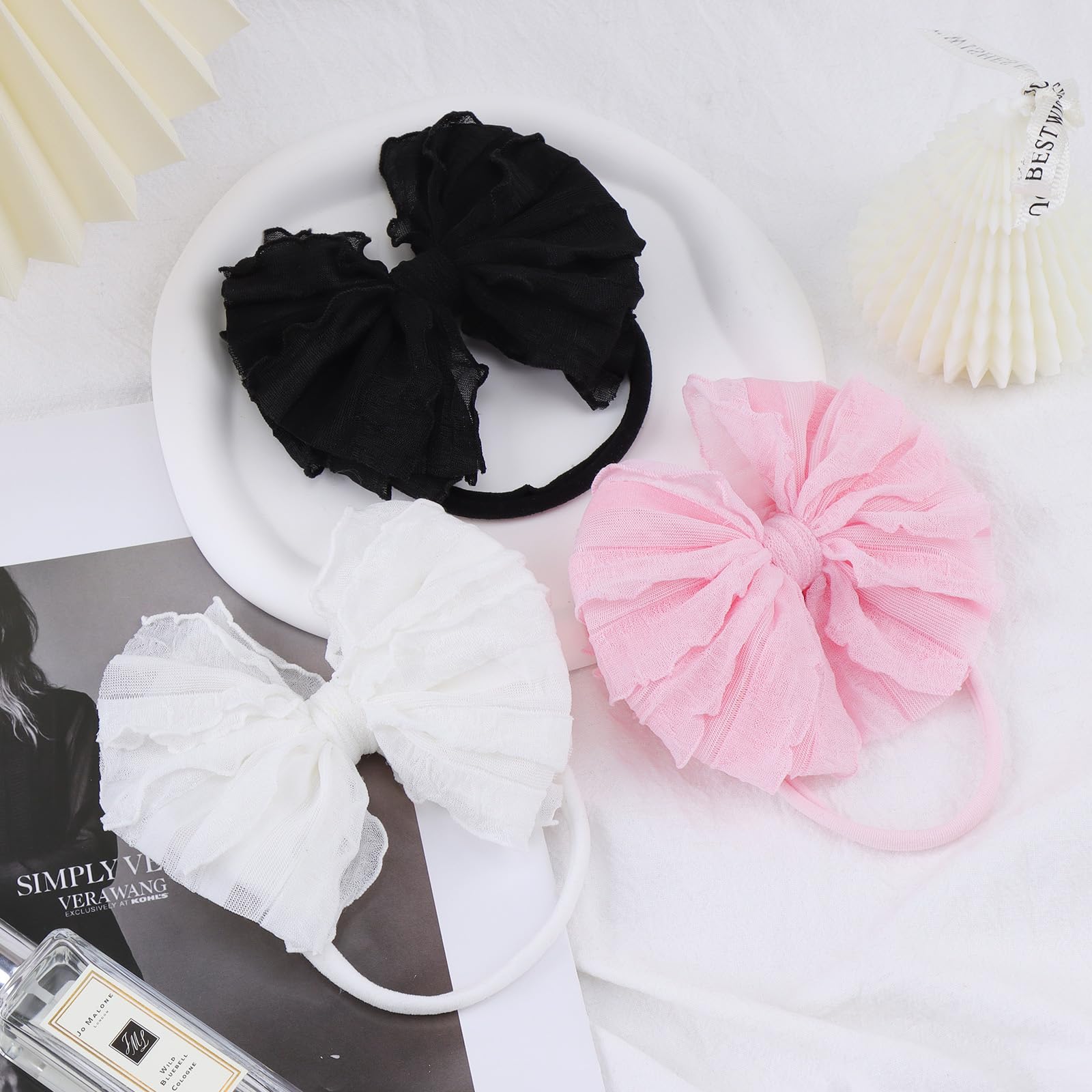 Lanmerry baby headbands on a toddler during a playful photoshoot.