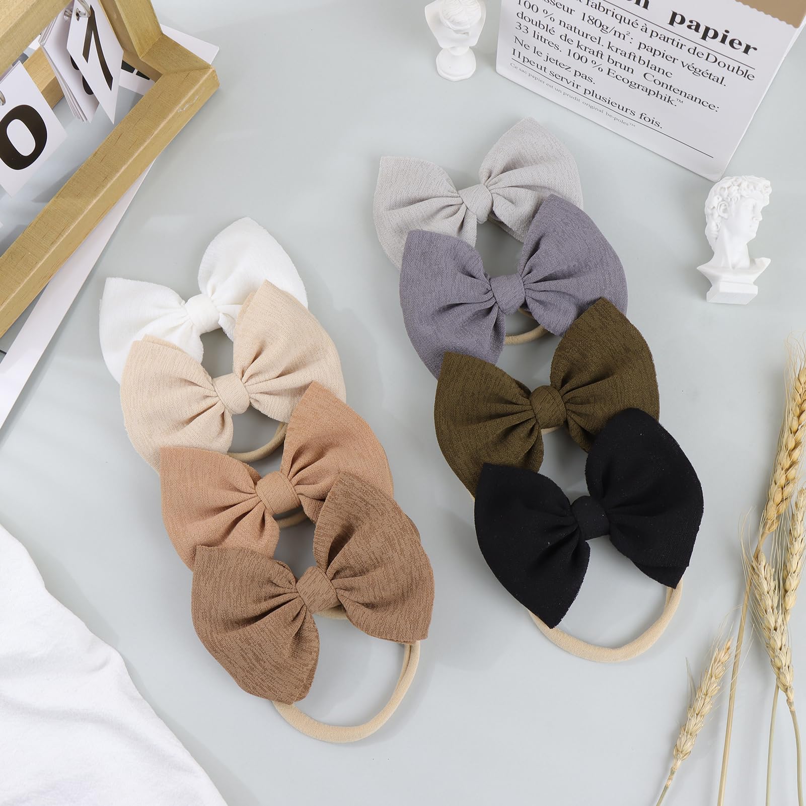 Lanmerry handmade bows add a cute touch to newborn and toddler looks.