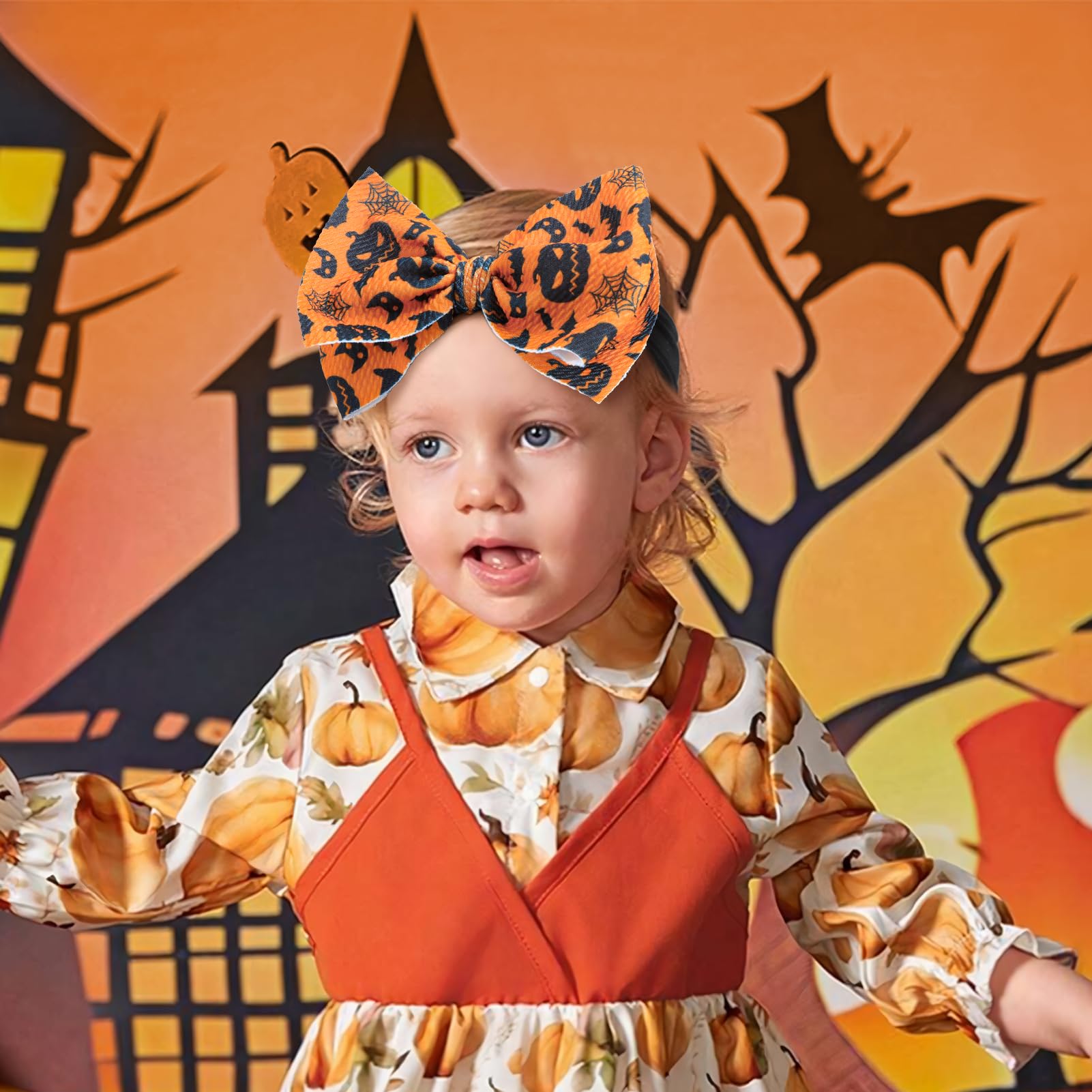 Lanmerry ghost-pattern bow for baby girl, secure elastic fit.