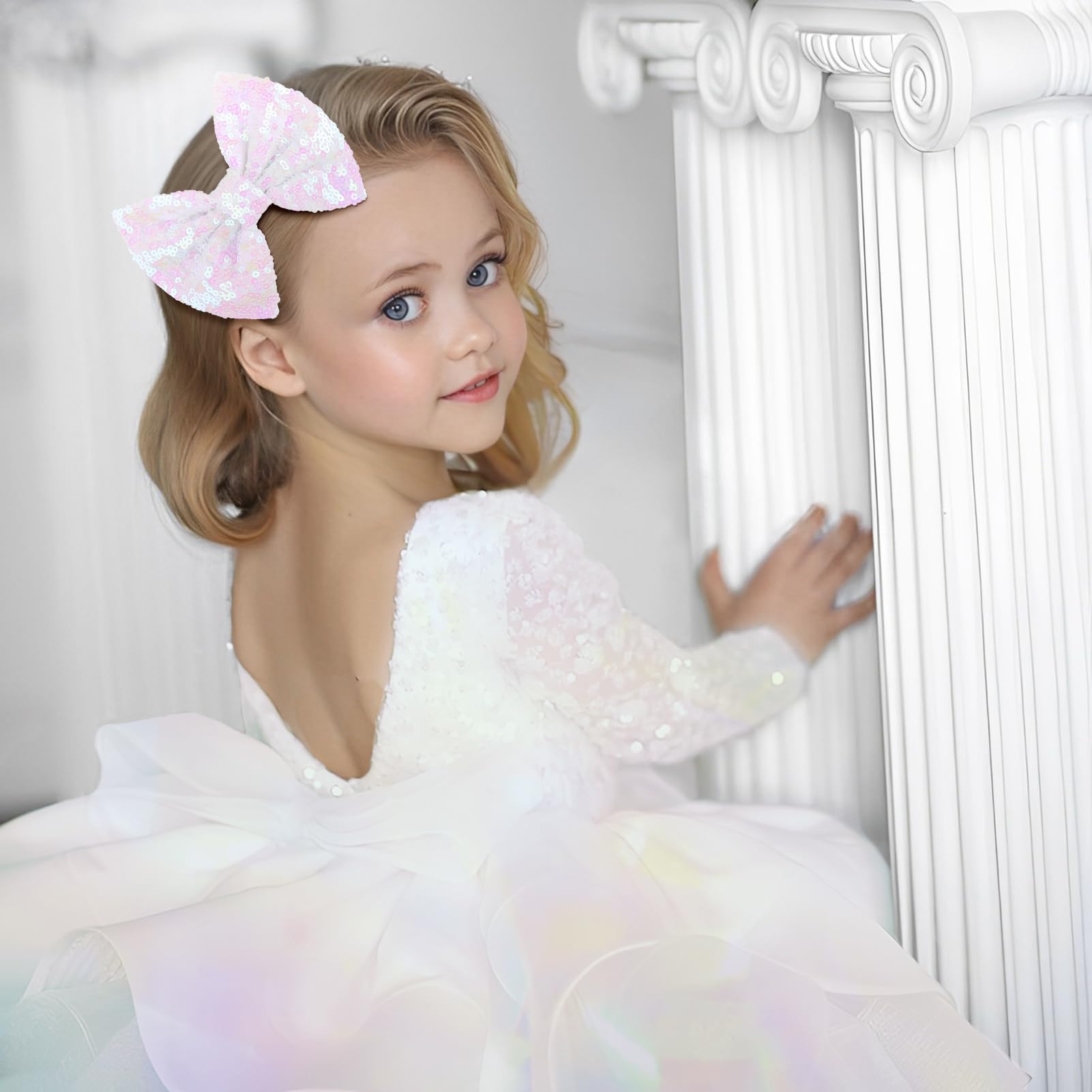 Lanmerry hair bow clip white sequin on hair showcases shiny finish for photos.