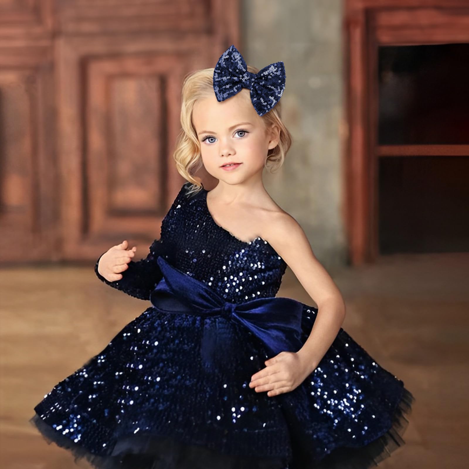 Lanmerry navy sequin bow clip with alligator grip keeps hair secure during activities.