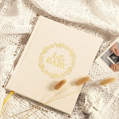 Lanpn Hello Baby memory book layout with linen pages—easy journaling for busy parents.