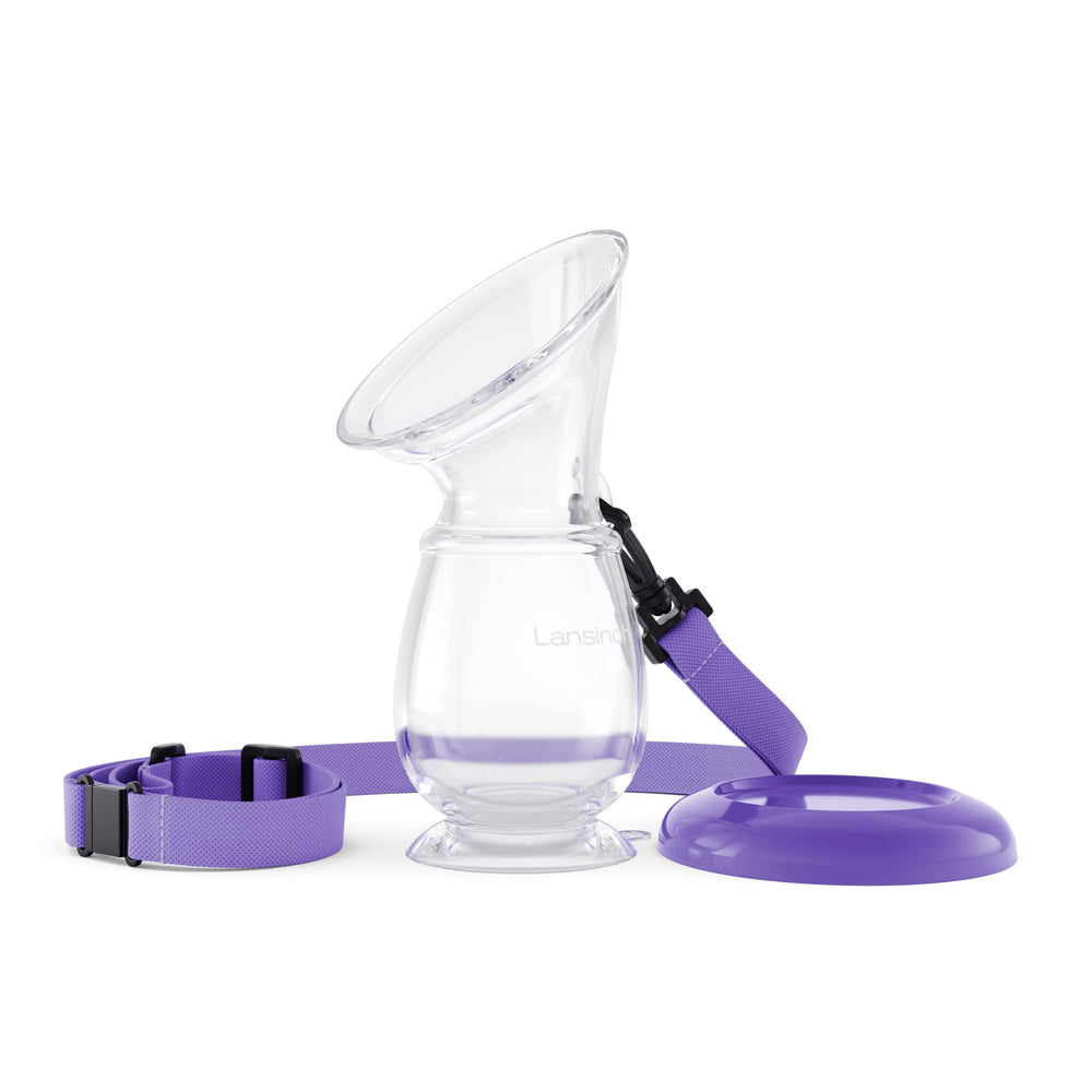 Lansinoh silicone milk collector attached to breast enables hands-free milk capture during feeding.