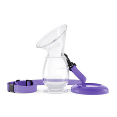 Lansinoh silicone milk collector attached to breast enables hands-free milk capture during feeding.