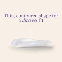 Lansinoh Stay Dry nursing pad contour highlighting slim, comfortable fit.