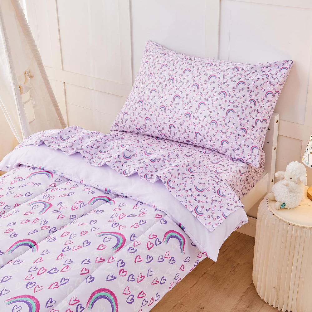 lasoftan child in bed with set scene shows cheerful rainbow decor and cozy bedtime environment.