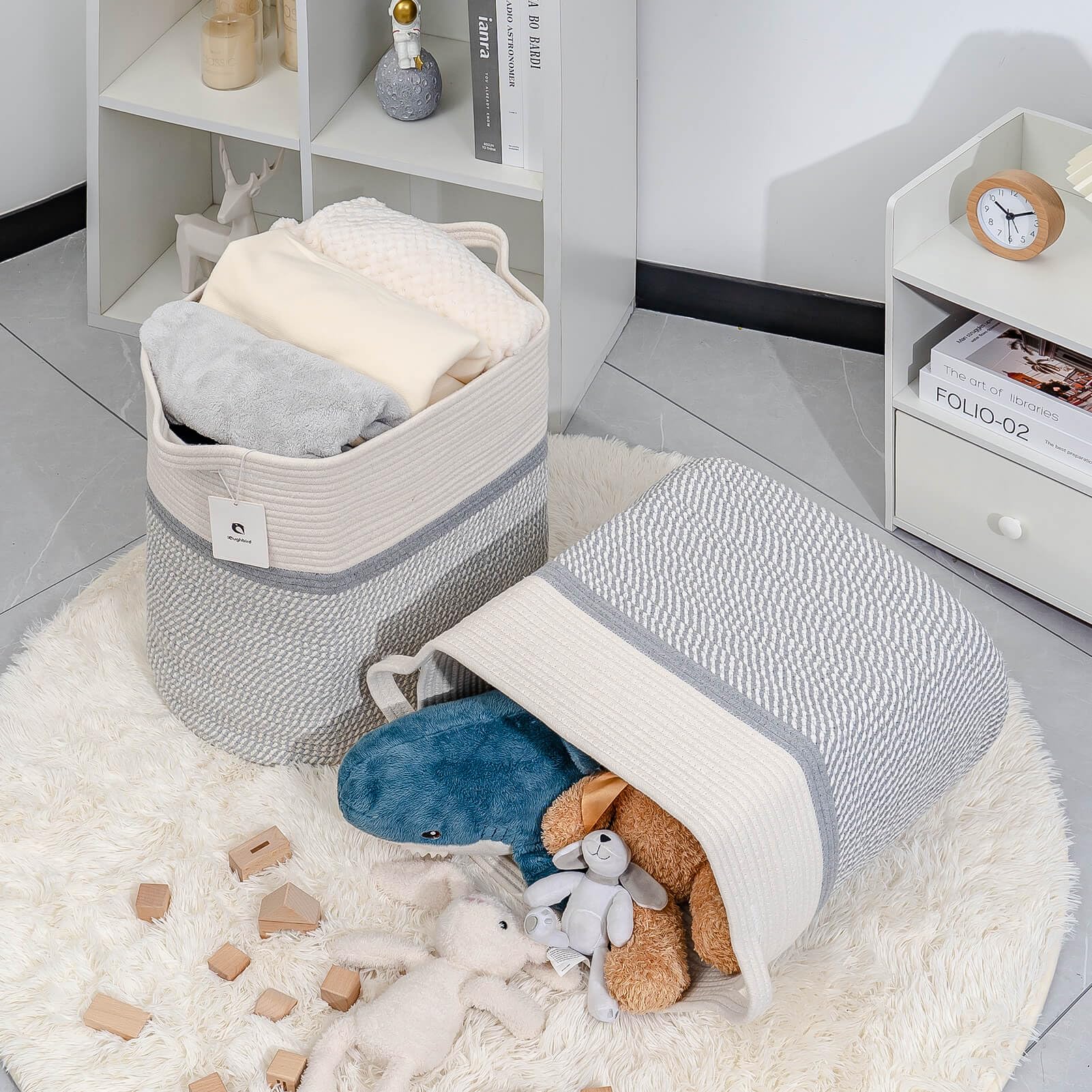 Laughbird storage basket with blankets used as a tall rectangle storage.