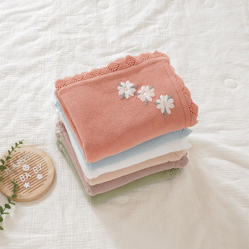 LAWKUL pink floral blanket in crib setting for naptime warmth